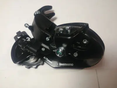 Задній перемикач Shimano Tourney RD-TY300, кріплення на вісь, 6/7 швидкостей
